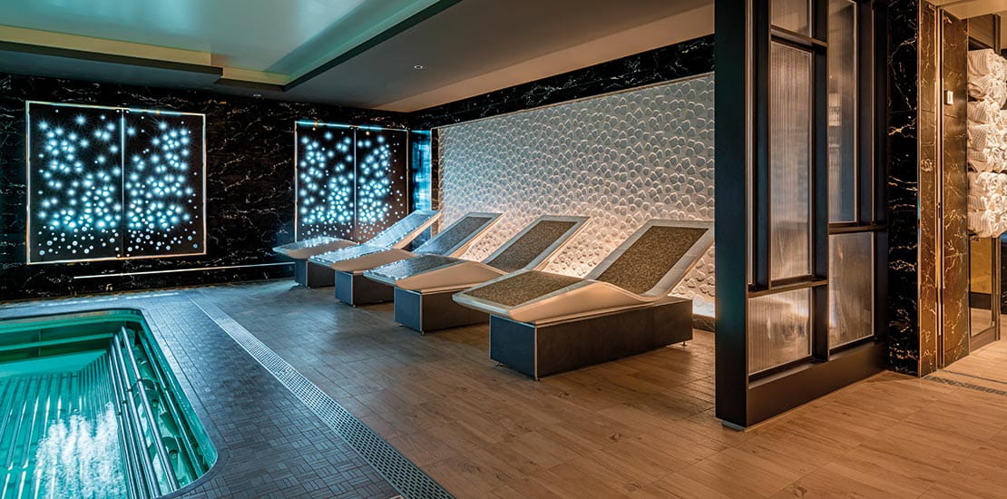 Relax on one of the thermal beds around the pool